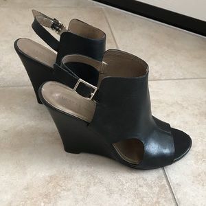 Black leather peep-toe wedges
